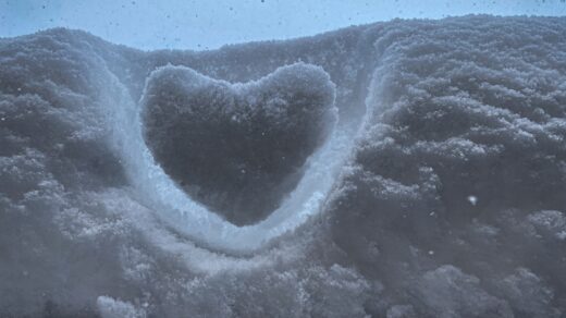 a heart shaped hole in the snow