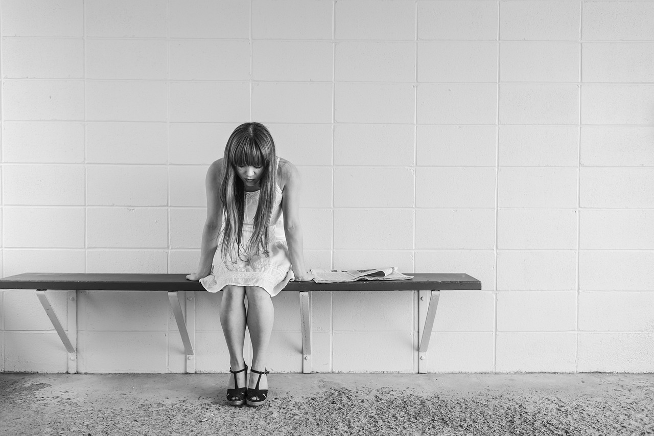 worried girl, woman, waiting, sitting, thinking, worry, black and white, sad, expression, people, person, depression, sadness, emotion, unhappy, adult, depressed, grief, frustration, despair, human, sad girl, problem, stressed, young, female, girl, long hair, dress, bench, concrete, wall
