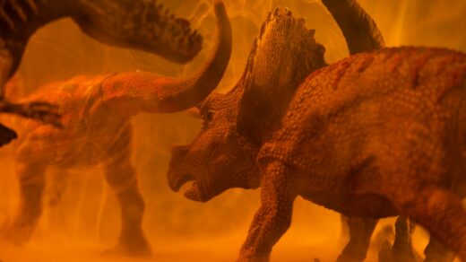 brown dinosaur on brown sand