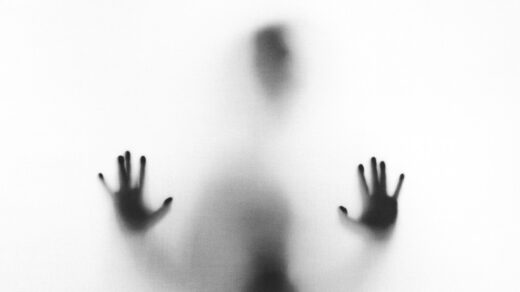 person behind fog glass