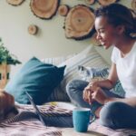 A woman works from home with pets.