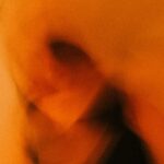 person in black shirt taking self portrait