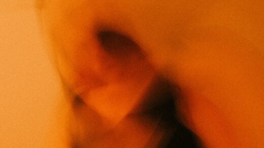person in black shirt taking self portrait