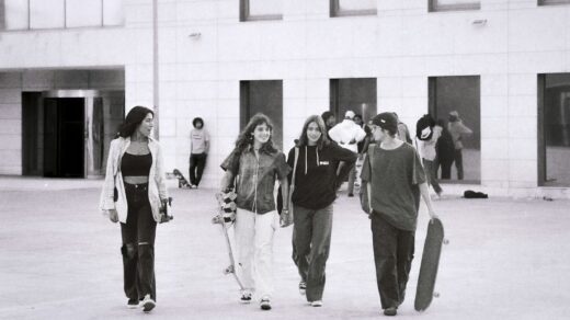 a group of gen Z kids walking down a street