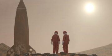 3 men standing on rocky shore during daytime
